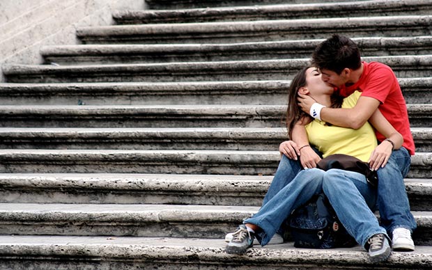 In-love couple kiss on the stairs