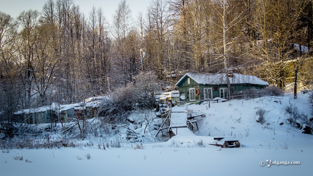 Wooden house in the snow hill forest